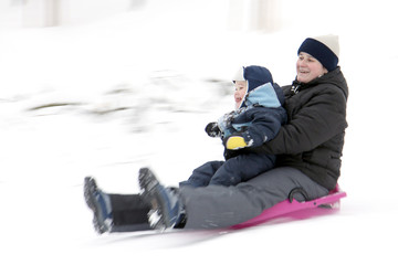Mother with son on bobsleigh