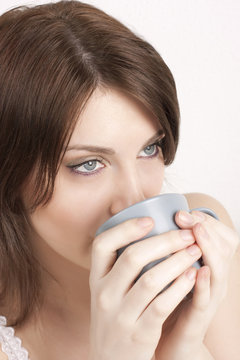 woman drinks coffee or tea