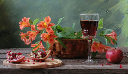 Red wine with pomegranate, apple and flowers