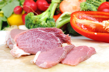 Preparing meal, meat and vegetables