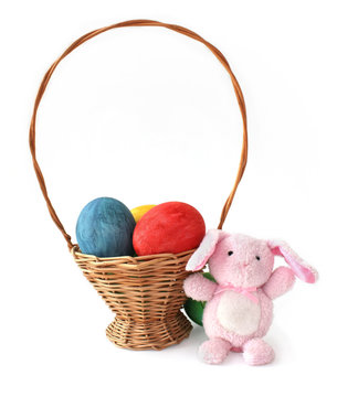 Painted Easter eggs and a rabbit in a basket