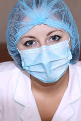 Closeup portrait of a young doctor wearing a mask