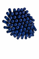 Blue ballpen caps in pattern over white background.