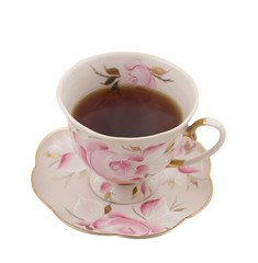 An antique tea cup with a plate