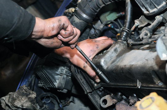 mechanic repairman at car repair work