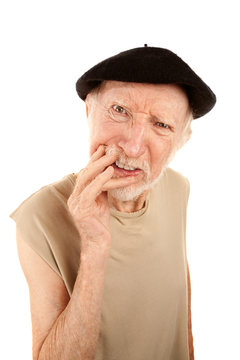 Confused senior man in beret