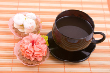 Cupcakes on the orange napkin and tea