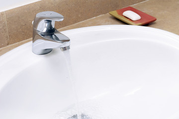 Faience sink and a piece of soap