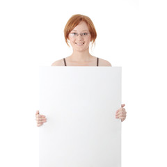 Fototapeta premium Young redhead woman with blank board