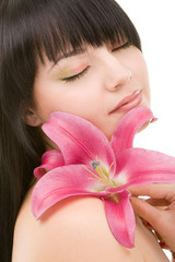 Obraz na płótnie Canvas Young pretty woman with lily flower