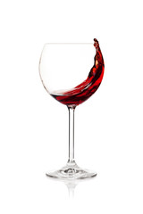 Splashing red wine in a glass