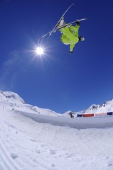 Jumping freestyle skier in the air