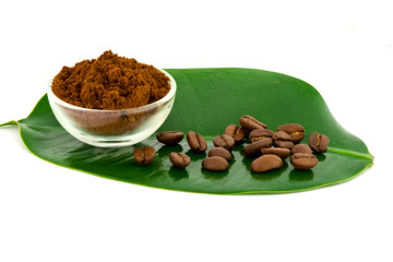 Coffee: whole beans and ground on leaf