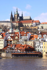 Obraz premium Early Spring in Prague - gothic Castle above the River Vltava