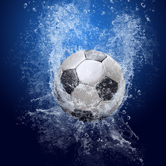 Water drops around soccer ball on blue background