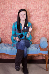 Naklejka premium Close up on a Teenager Drinking Coffee