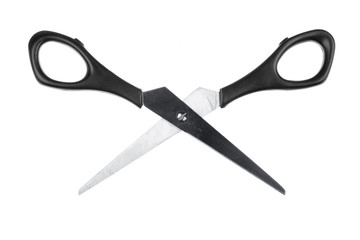 Modern metal scissors on a white background..