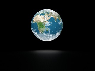 Earth model on black background with shadow