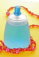 Perfume bottle on yellow background