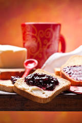 Healthy and nutrient breakfast: toast with butter and jam