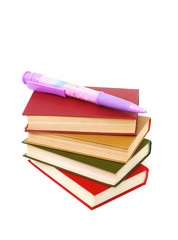 stack of books and a very large ball-point pen isolated on white