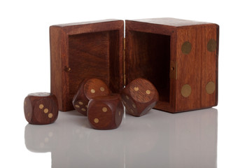 Four die and open box on white isolated background