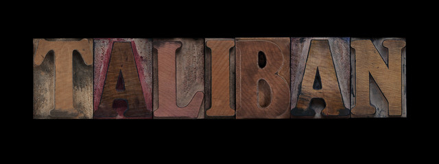 the word Taliban in old letterpress wood type
