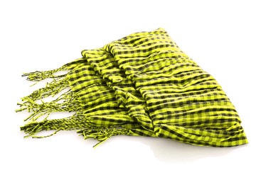 Fototapeta premium Scarf. A winter warm yellow scarf over white