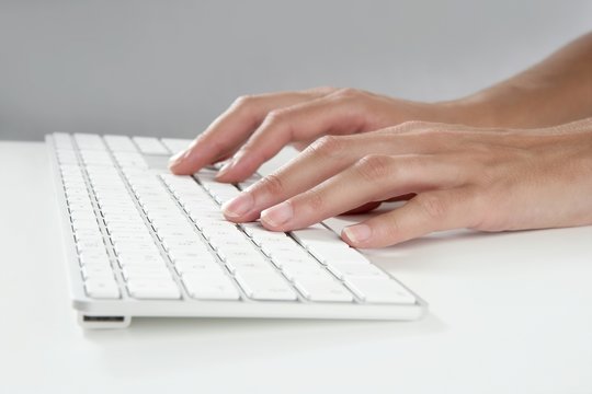 woman hands typing keyboard