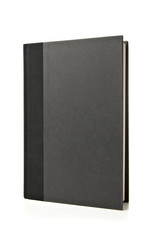 Black Book Standing Up on White Background