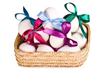 Basket with eggs, on a white