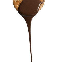 Chocolate dropping from biscuit