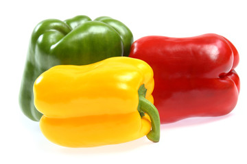 red, yellow and green paprika on white