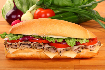 A large ham and tomato sandwich