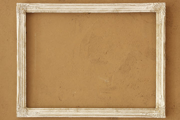 Fototapeta premium vintage picture frame on the clay wall