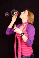 girl blowing bubbles