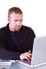 Young Casual Businessman Working at his Desk