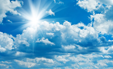 Naklejka na ściany i meble blue cloudy sky with sun