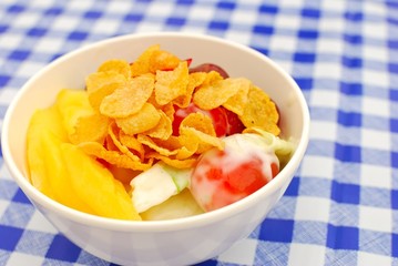 Healthy fruit salad topped with cereal