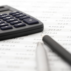 Pencil, pen and calculator close-up