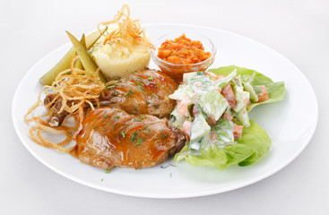 Meat plate with potatoes.