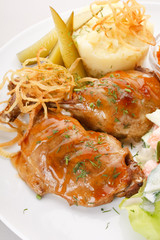 Meat plate with potatoes.