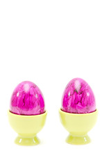 eggs in eggcups isolated on white. easter..