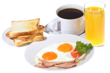 Freshly breakfast with fried egg, vegetables, toasts, coffee and
