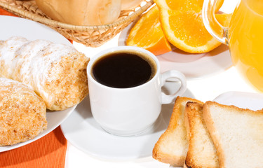 Breakfast with toasts, croissants, coffee, orange juice