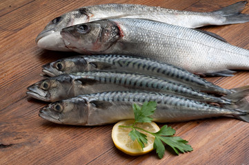 variety of fish on wood