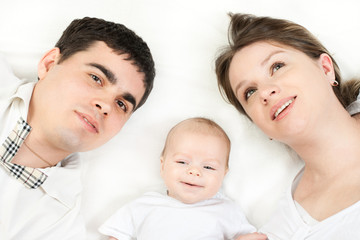happy family - mother, father and baby