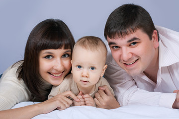 happy family - father, mother and baby