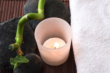 Candle, stones and towel