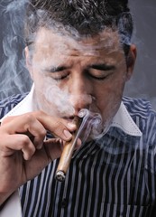 Portrait of a man smoking cigar